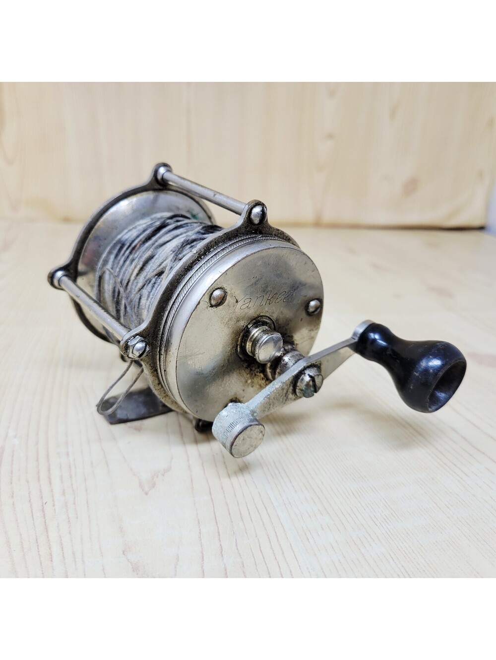 Vtg Yankee 200 Raised Pillar Fishing Reel - with original, braided, metal line.